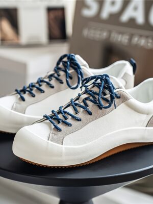Zapatillas de skate casuales de plataforma de puntera ancha para hombre, de color de contraste blanco y con cordones con detalles amarillos, zapatillas de lona de estilo vintage japonés con diseño de lazo en el talón, versátiles para desplazamientos diarios, escuela y moda urbana